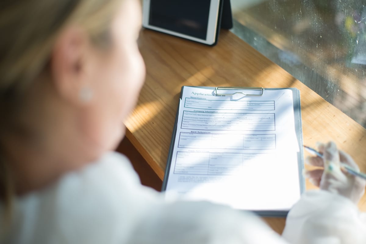 A person filling out a visa application form