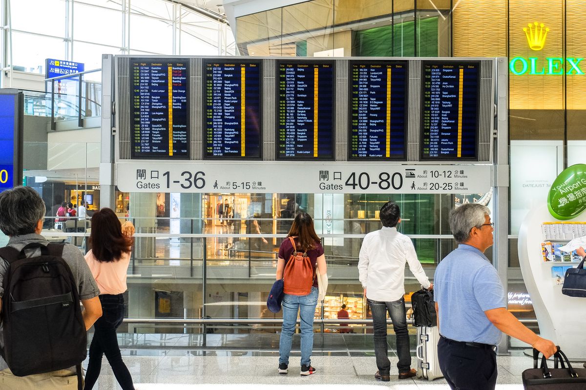Departure board showing flights to Beijing, Shanghai and other China cities