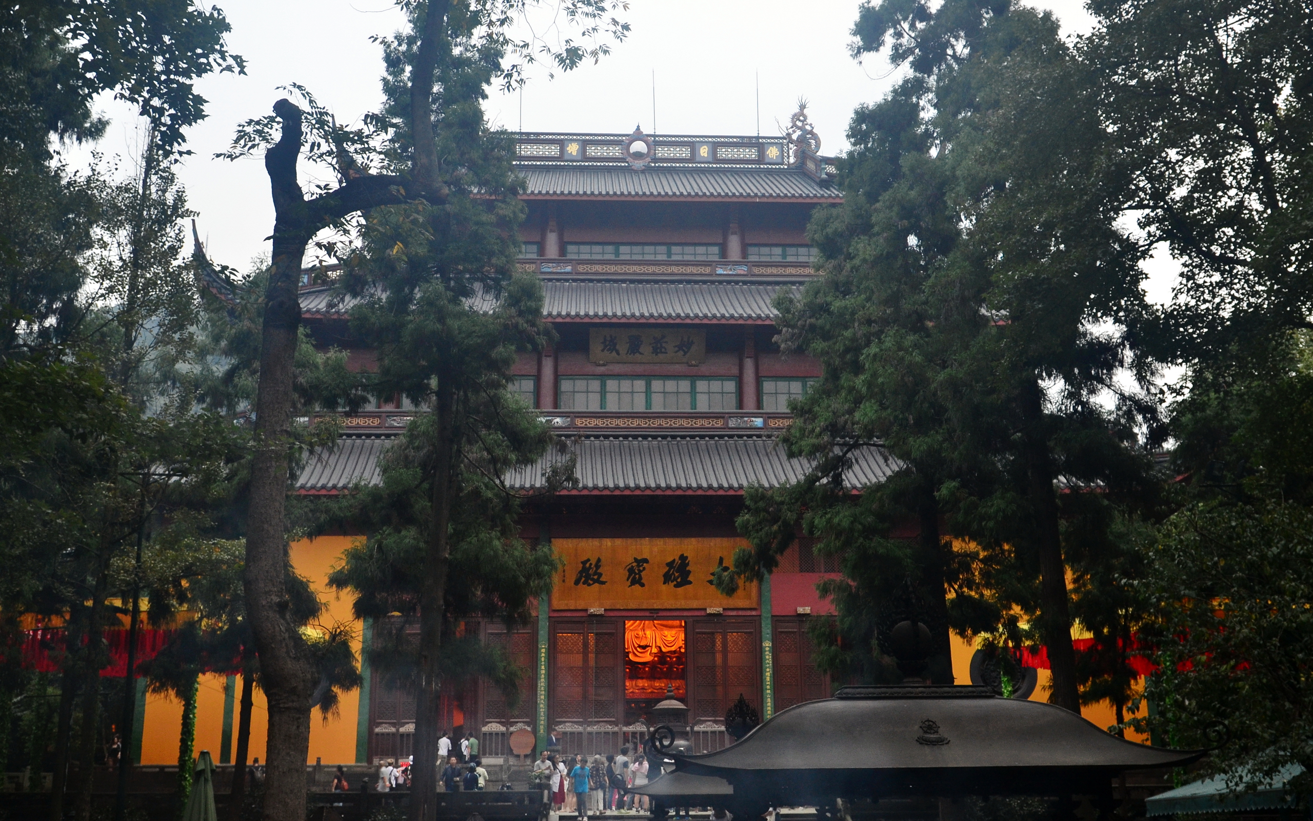 The Mahavira Hall of Lingyin Temple framed by ancient trees