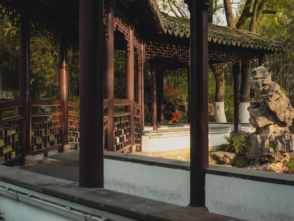 Latticed wooden walkway and rockery in a classical Suzhou garden