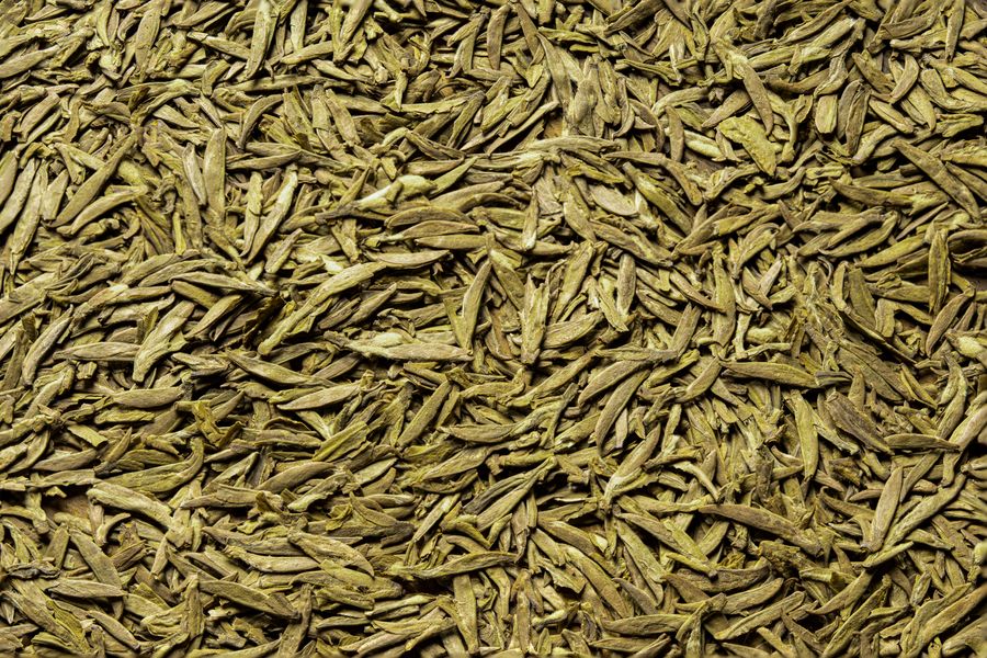 Flat-pressed Longjing (Dragon Well) green tea leaves