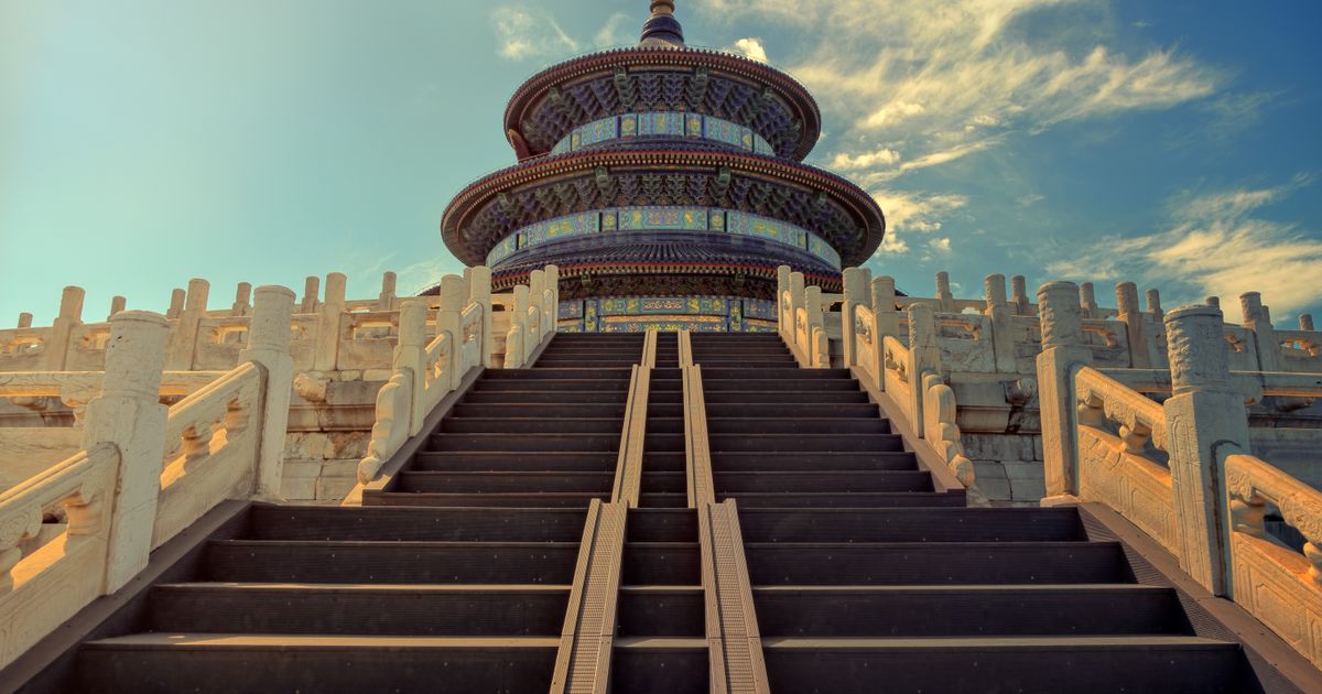 A long marble stairway leading up to the Temple of Heaven, framed by carved stone balustrades