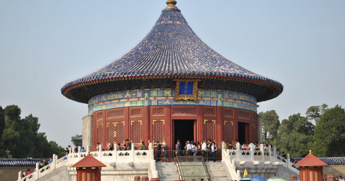 Worshippers and visitors gathered around the round Imperial Vault of Heaven inside the Temple of Heaven complex