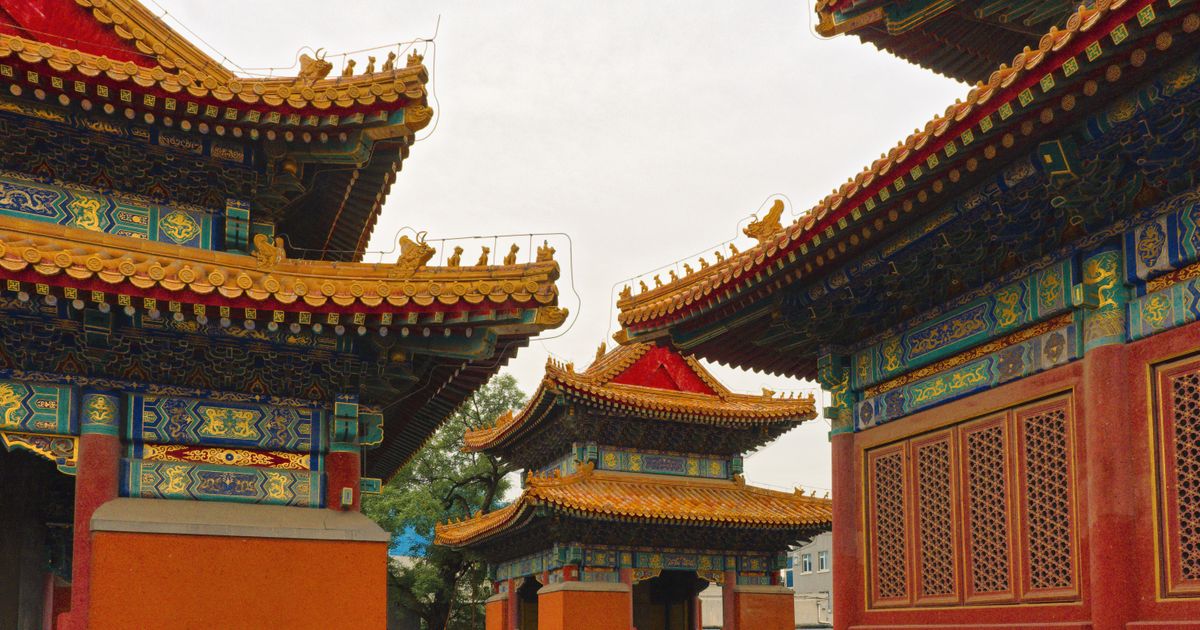 Golden ornate roofs of the Lama Temple halls in Beijing