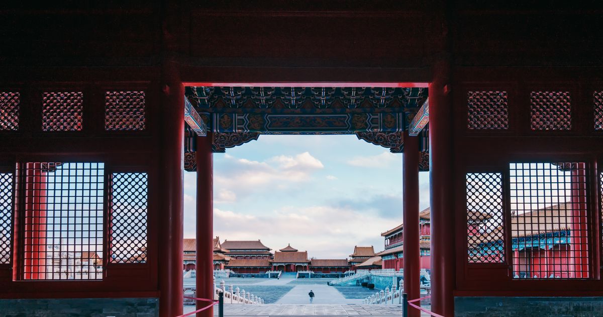 View through a palace gate into a Forbidden City courtyard