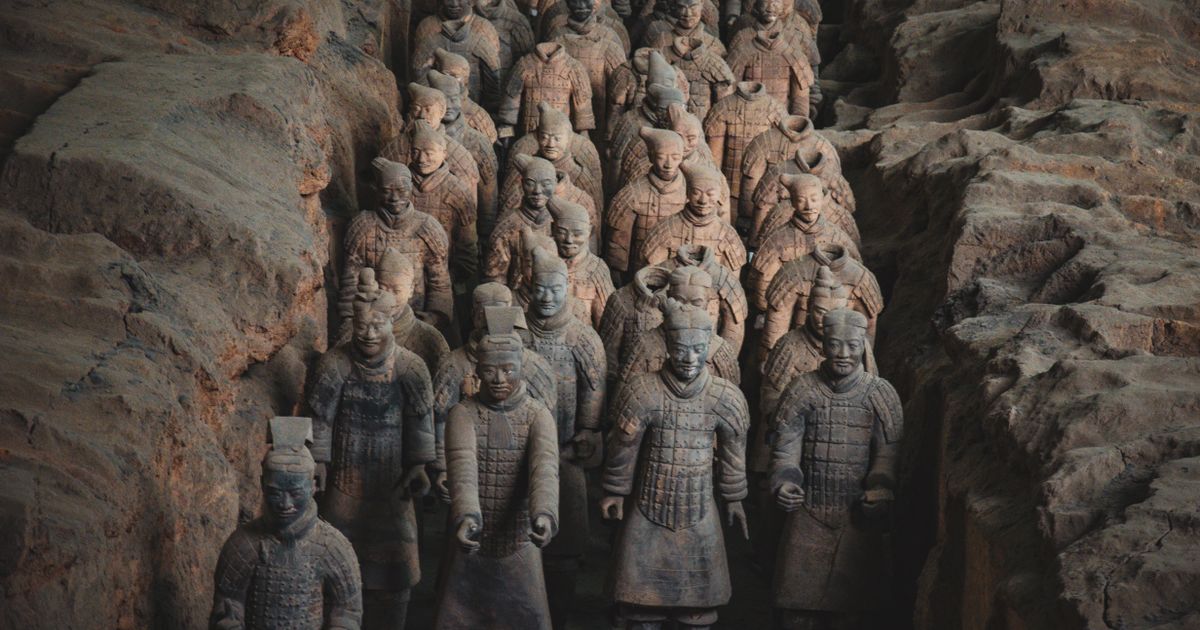 Rows of Terracotta Warriors standing in the excavation pit