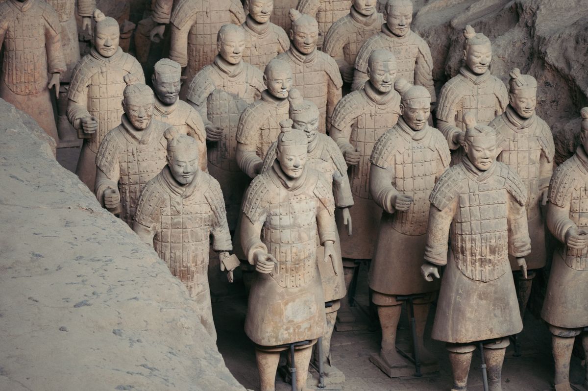 Close-up detail of individual terracotta warriors showing unique faces and armour