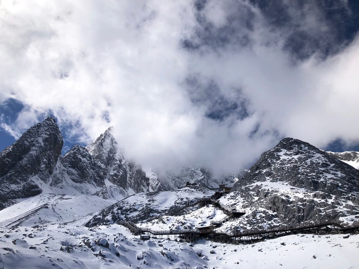 Snow-capped peaks and boardwalk at Jade Dragon Snow Mountain