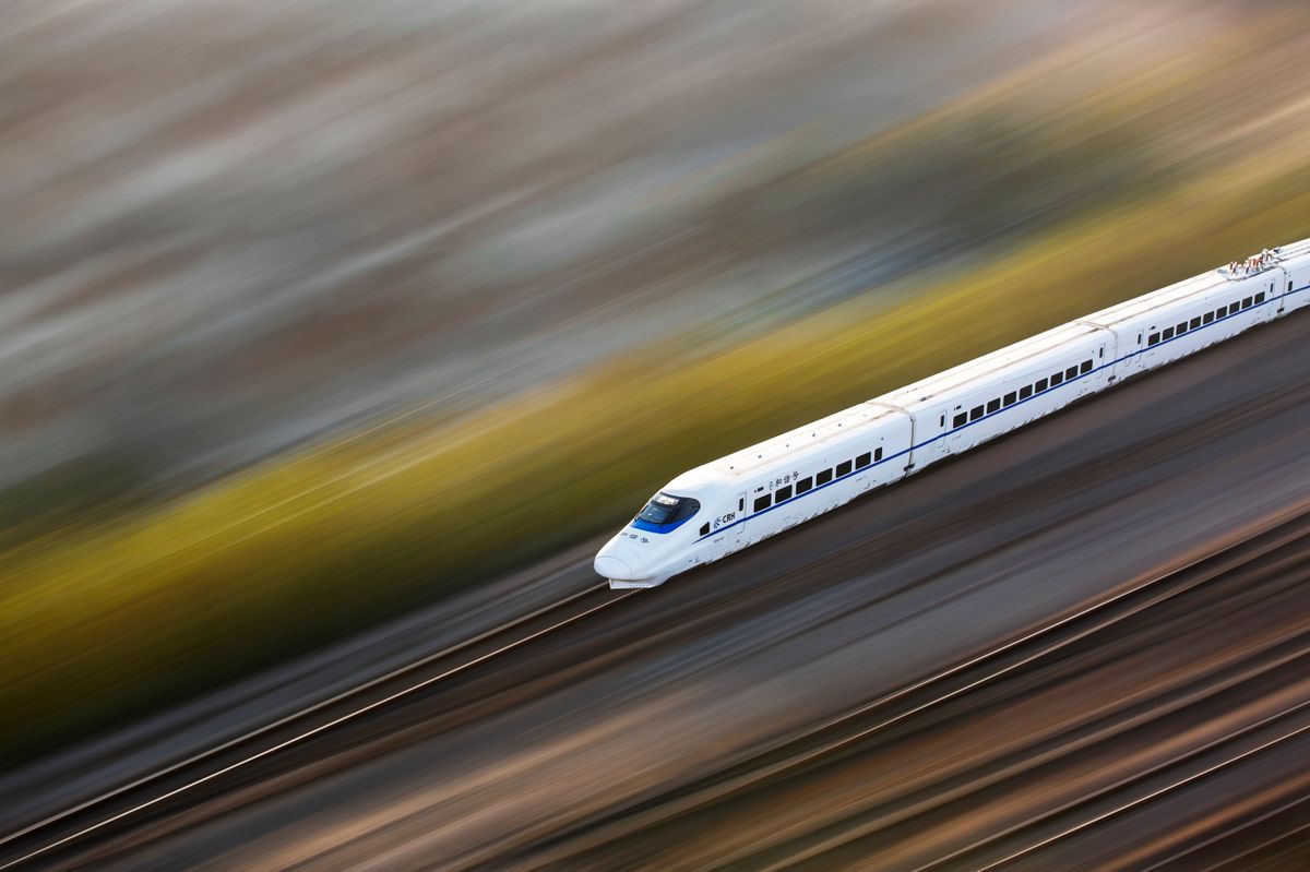 A Chinese high-speed train speeding along the line
