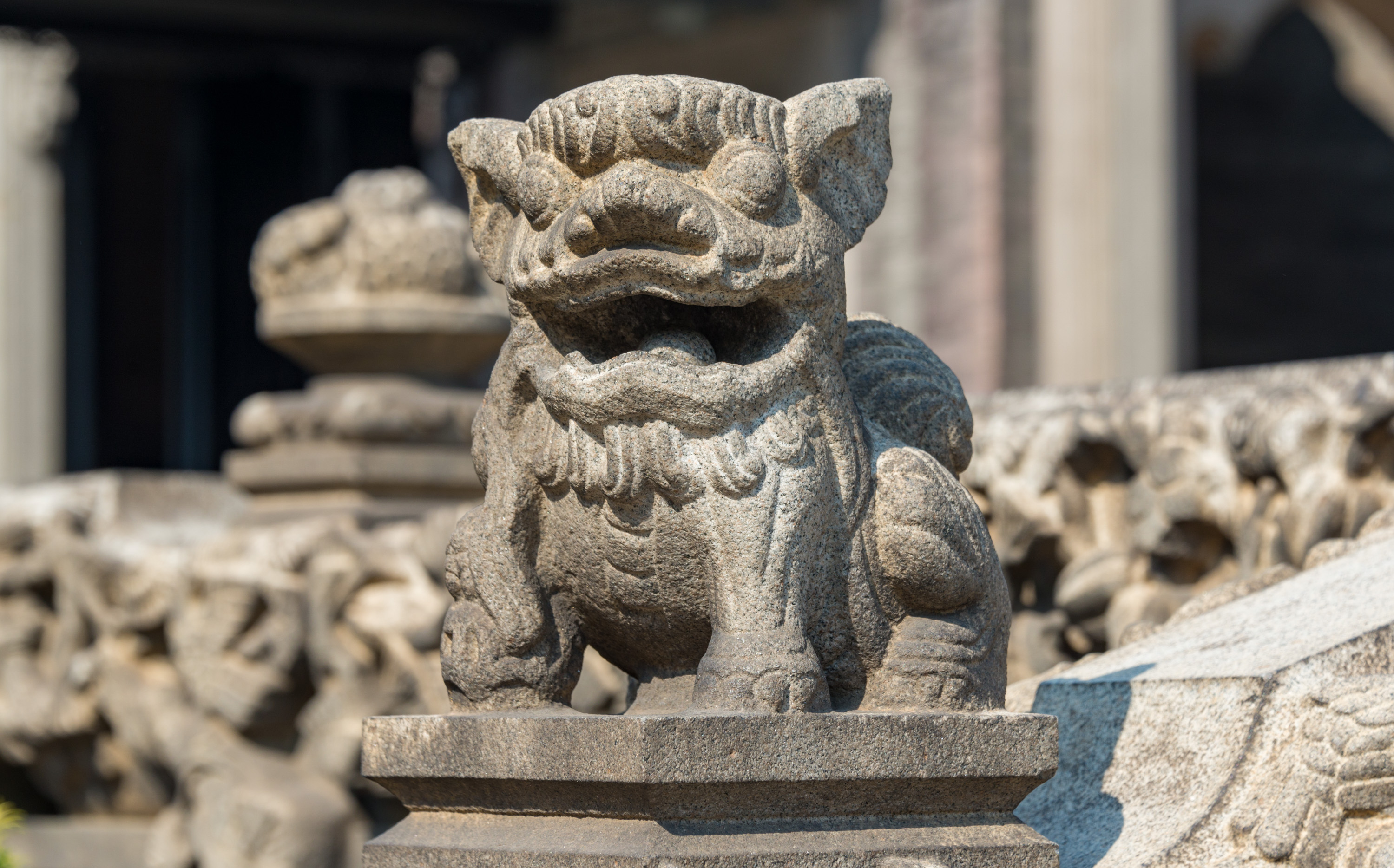 A carved stone guardian lion at the Chen Clan Ancestral Hall