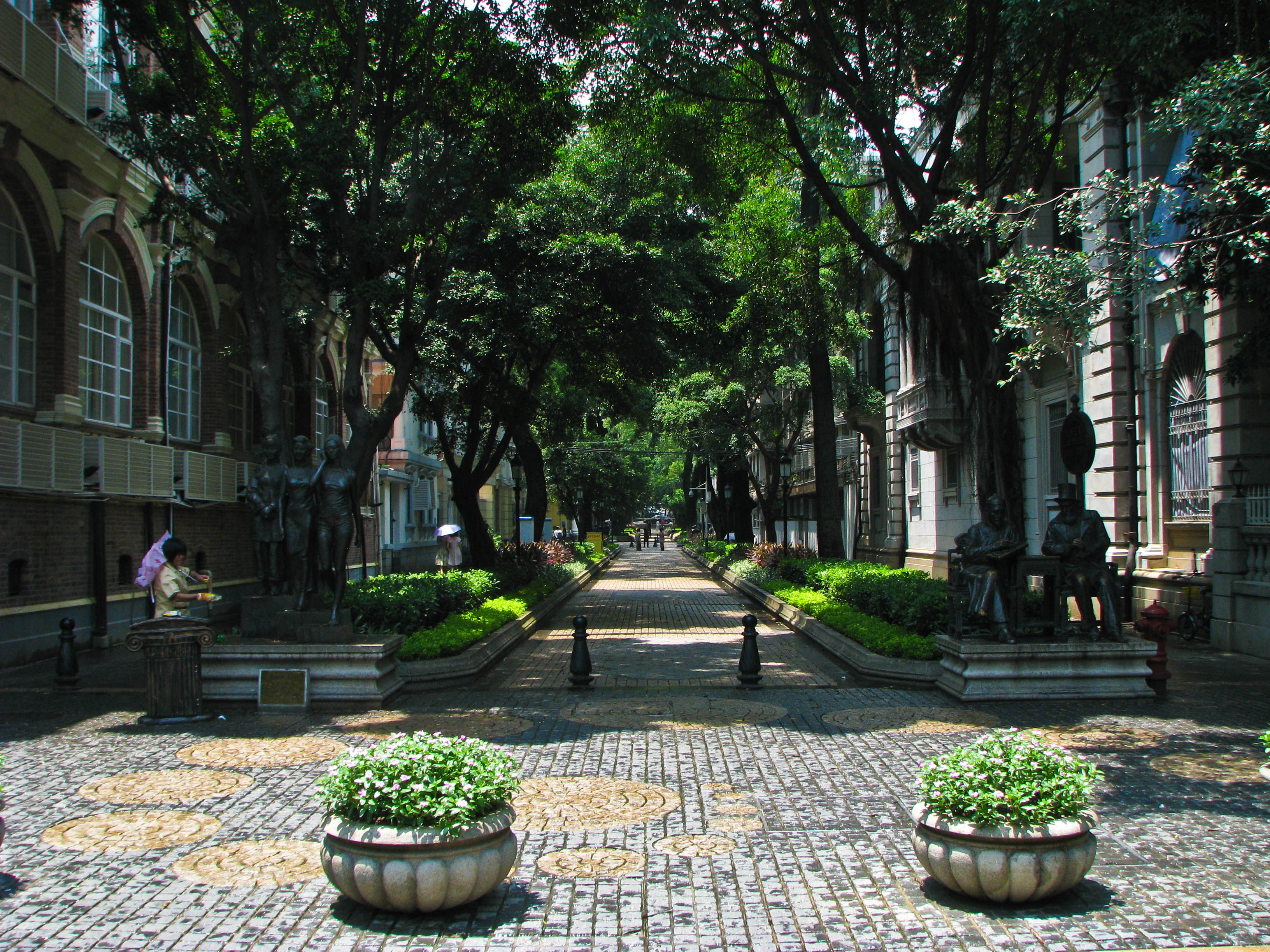 A pastel colonial mansion on a tree-lined street of Shamian Island
