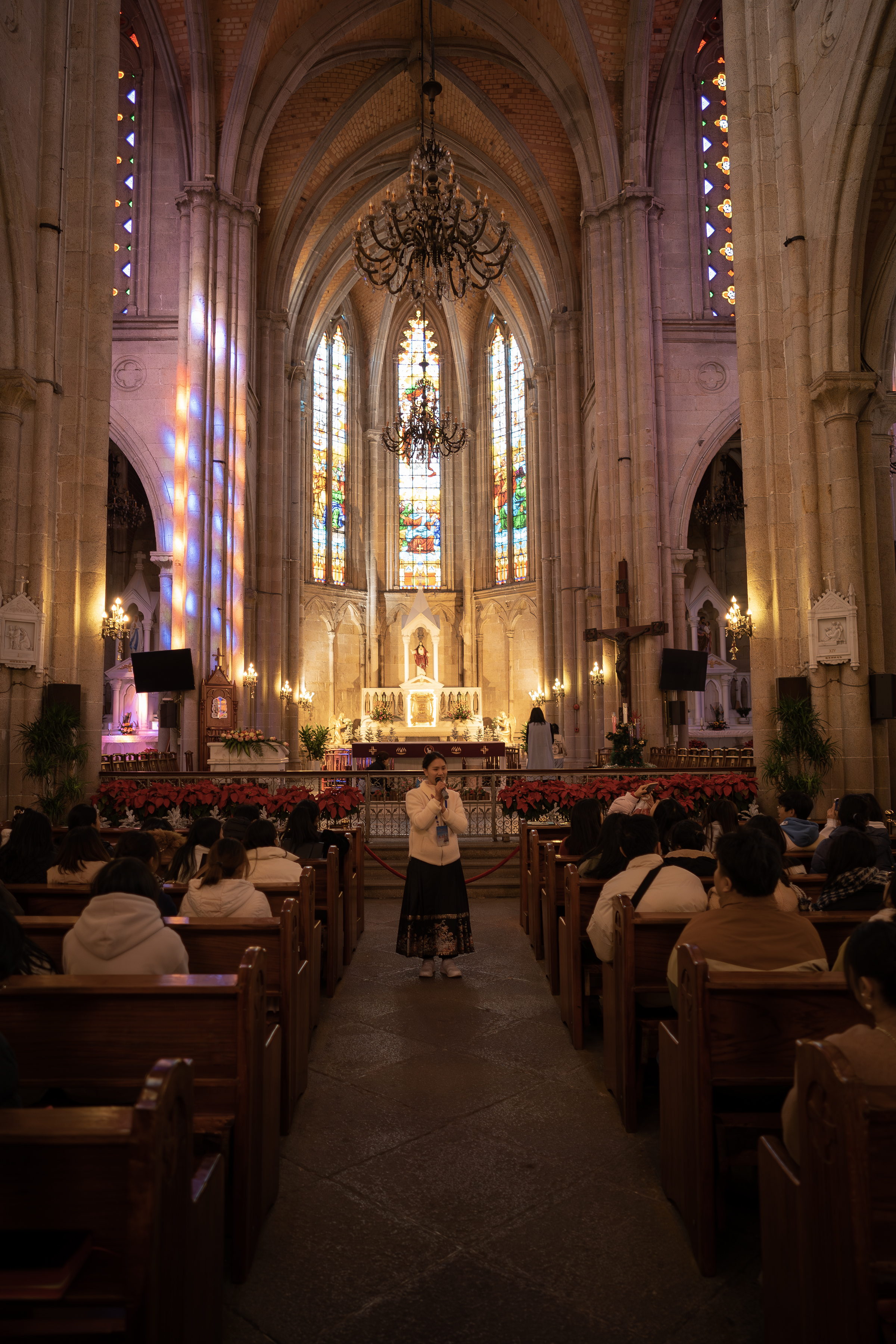 The illuminated interior nave of Sacred Heart Cathedral