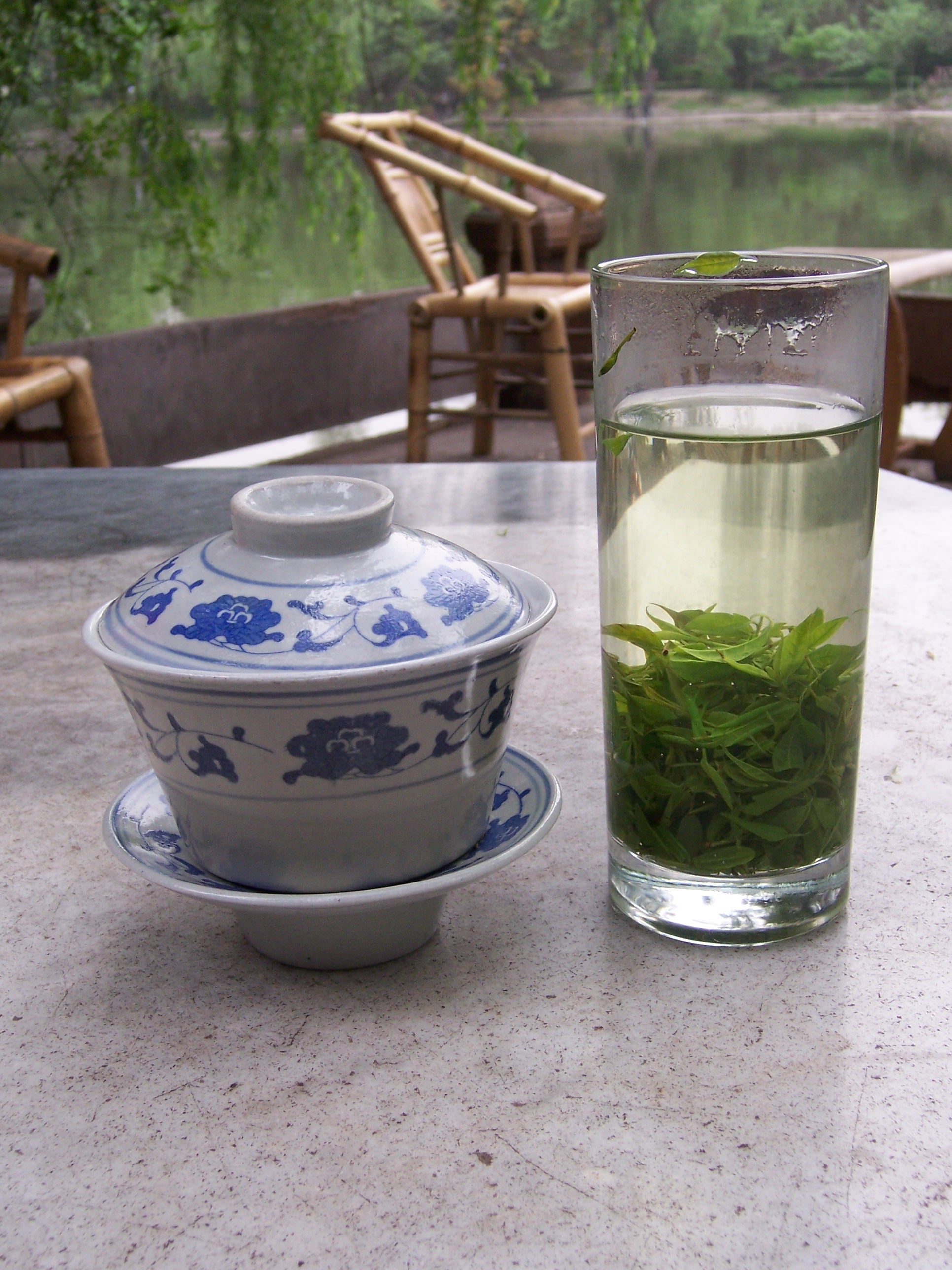 People sipping tea at an open-air teahouse in People's Park, Chengdu