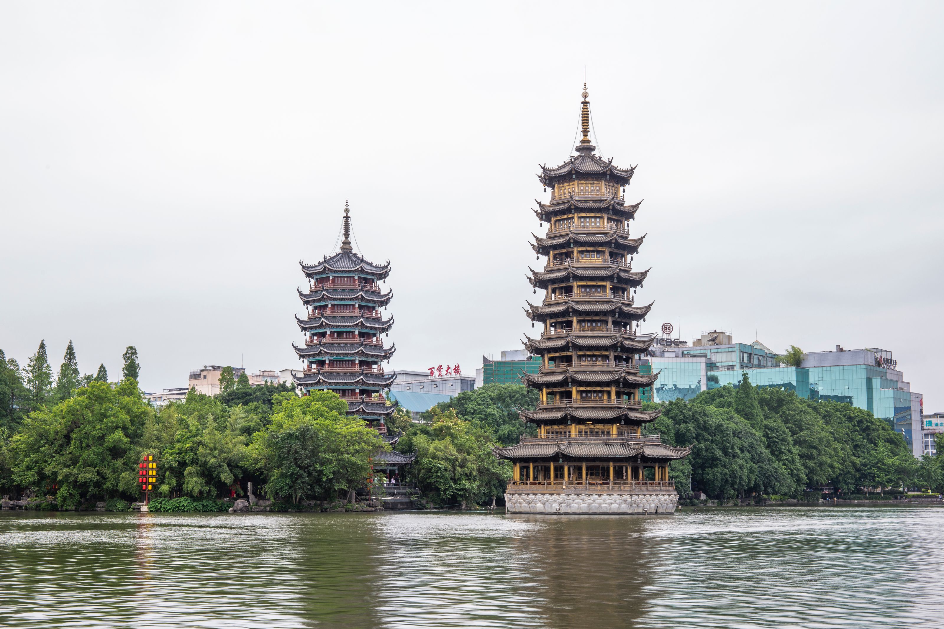 The twin Sun and Moon Pagodas on Shan Lake seen by day