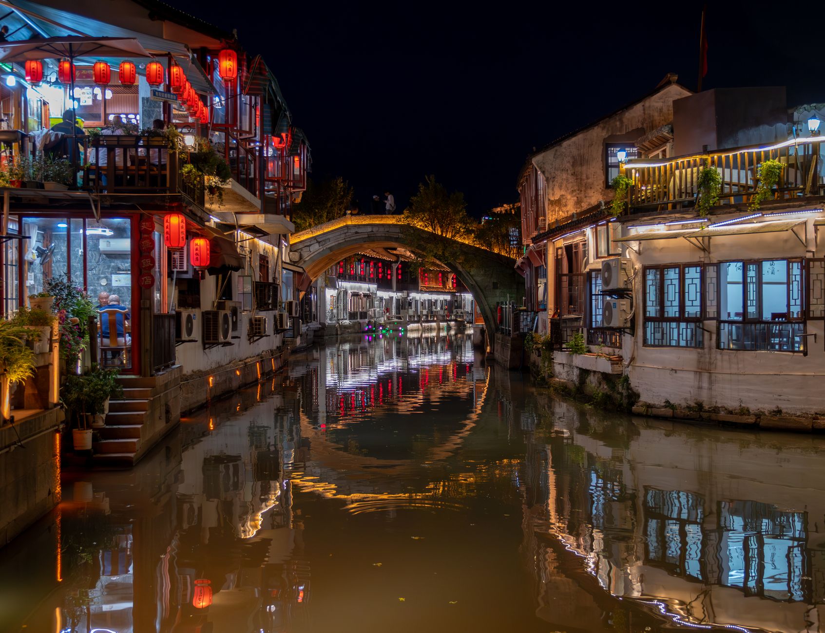 Arched bridge and red lanterns over the canal