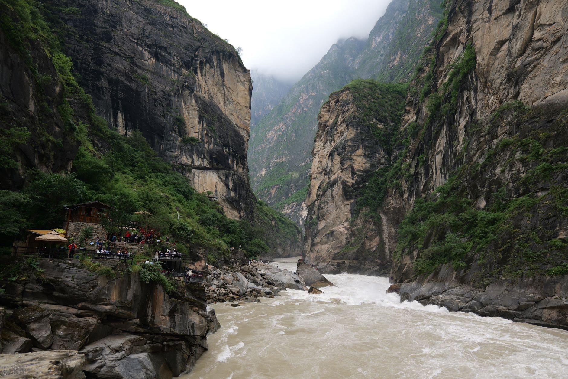 Sheer cliffs and the raging Jinsha River in Tiger Leaping Gorge