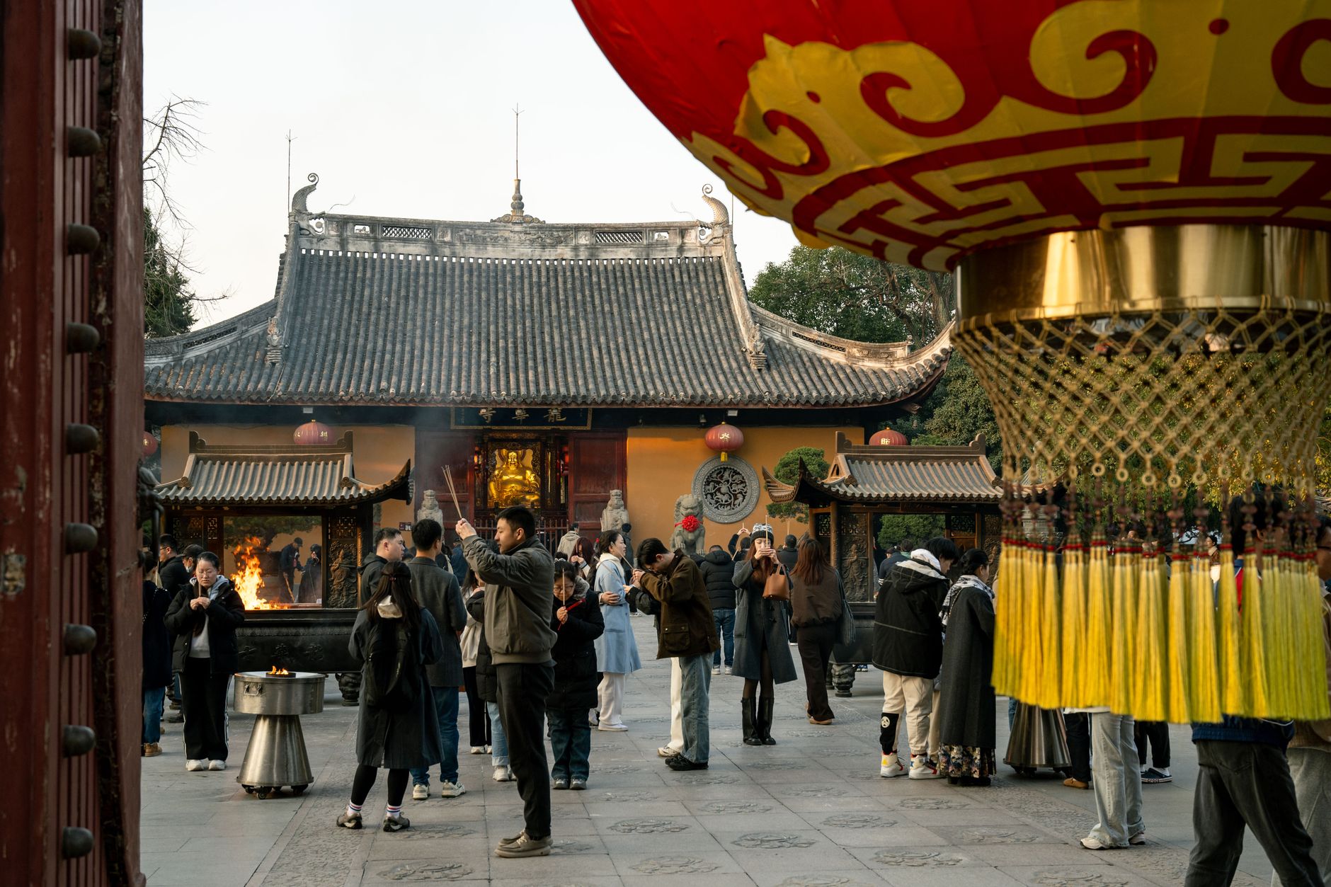 Courtyard with incense burner and visitors