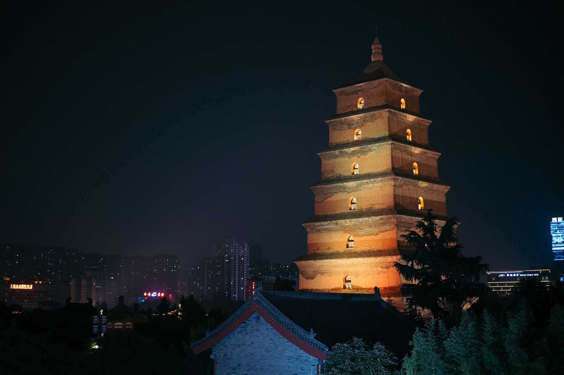 The Big Wild Goose Pagoda glowing at golden hour above the temple gardens