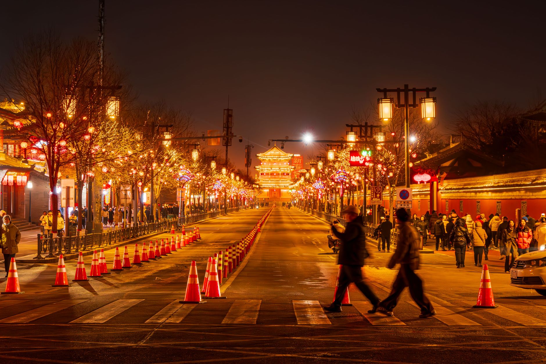 A Muslim Quarter street glowing with red lanterns in the evening