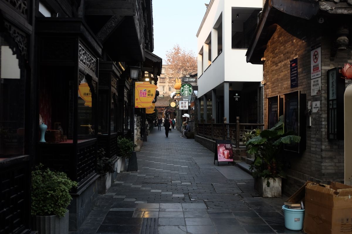 A quiet historic alley lined with traditional buildings off Hefang Street