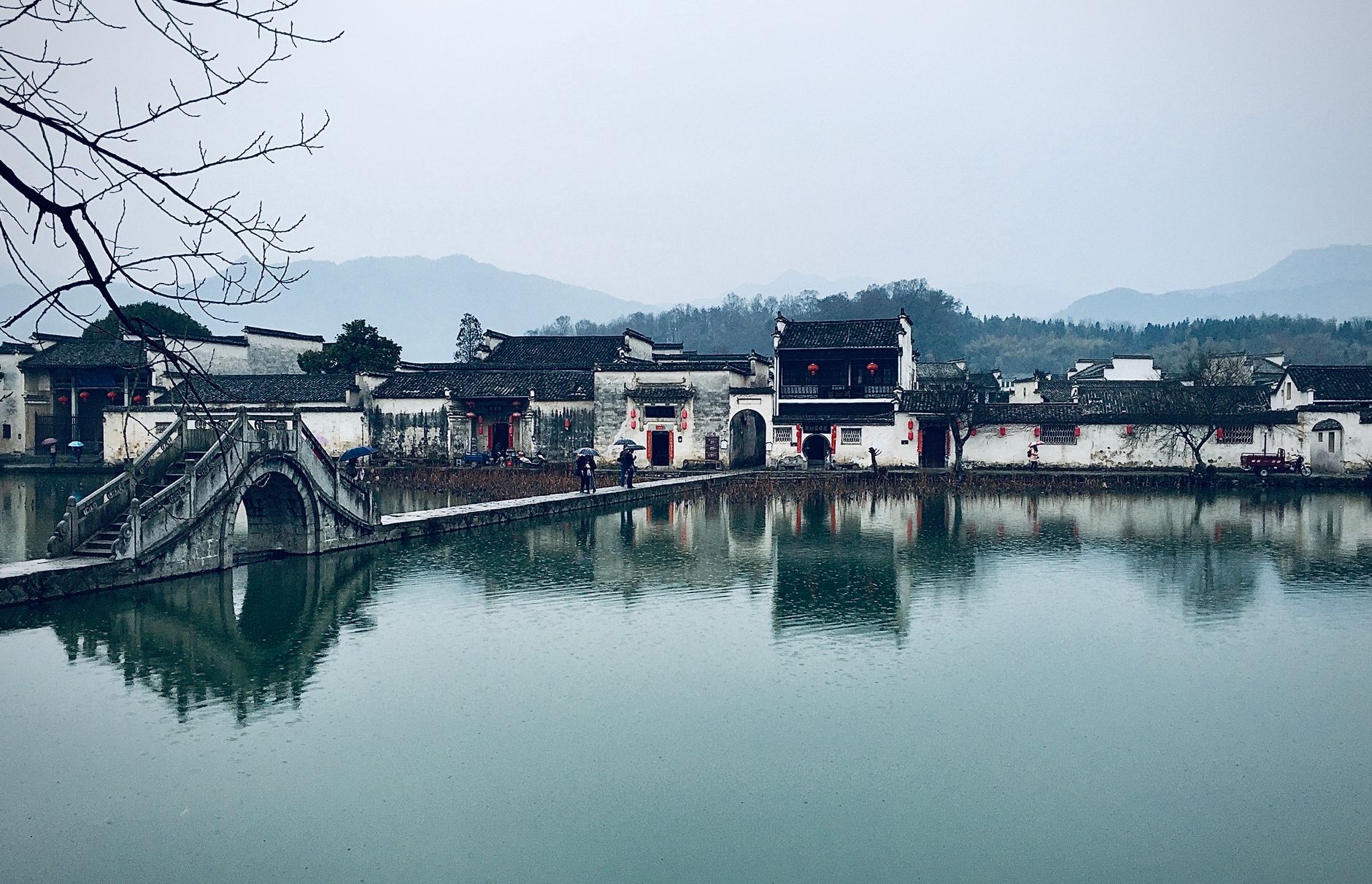 The Moon Pond reflecting whitewashed Huizhou houses at Hongcun Ancient Village