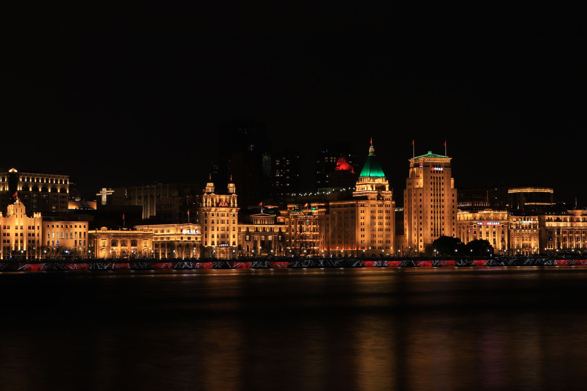 The illuminated colonial buildings of the Shanghai Bund at night