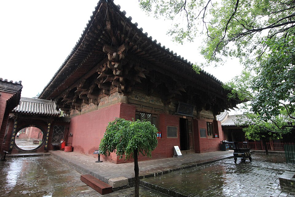 Dramatic dougong bracket-sets beneath the eaves of the Wanfo Hall