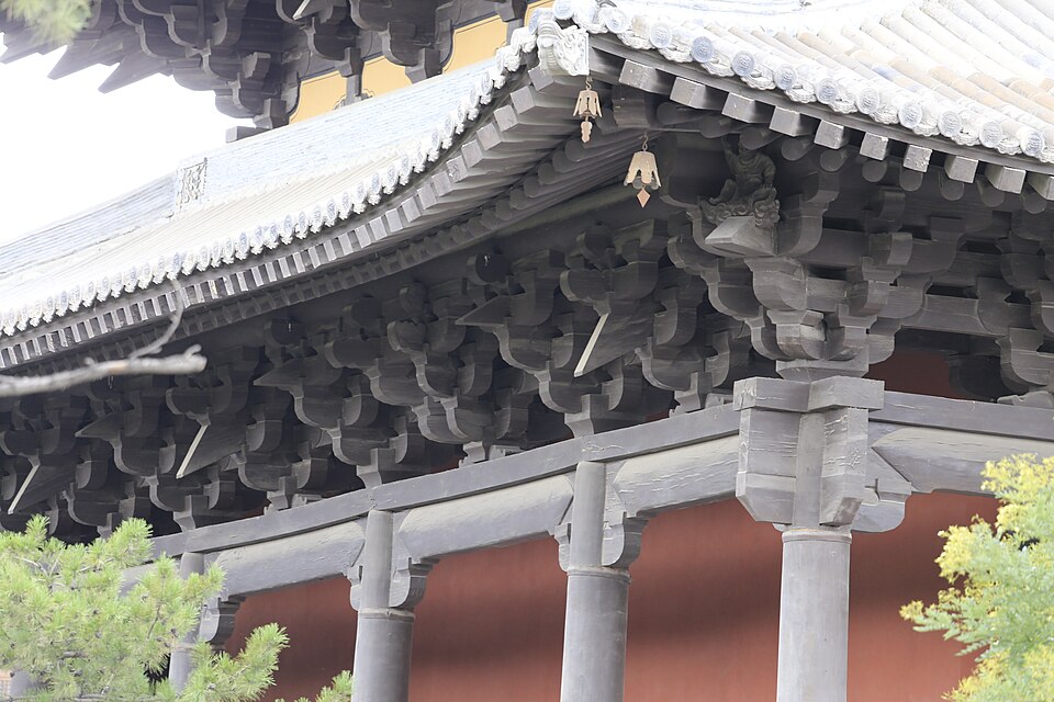 Carved timber bracket sets under the eaves of a Huayan Temple hall