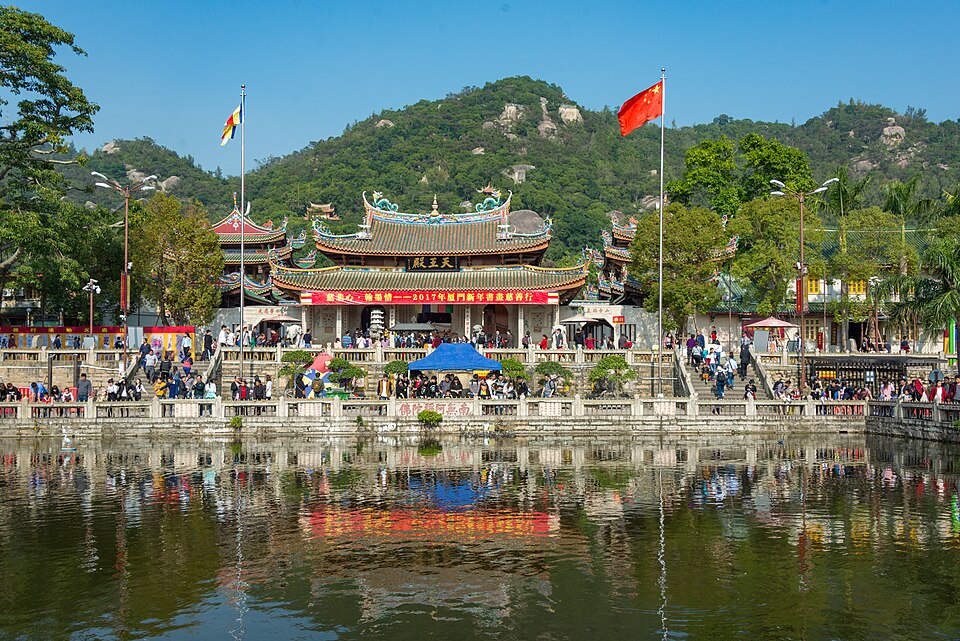 The Heavenly Kings Hall of Nanputuo Temple reflected in the pond