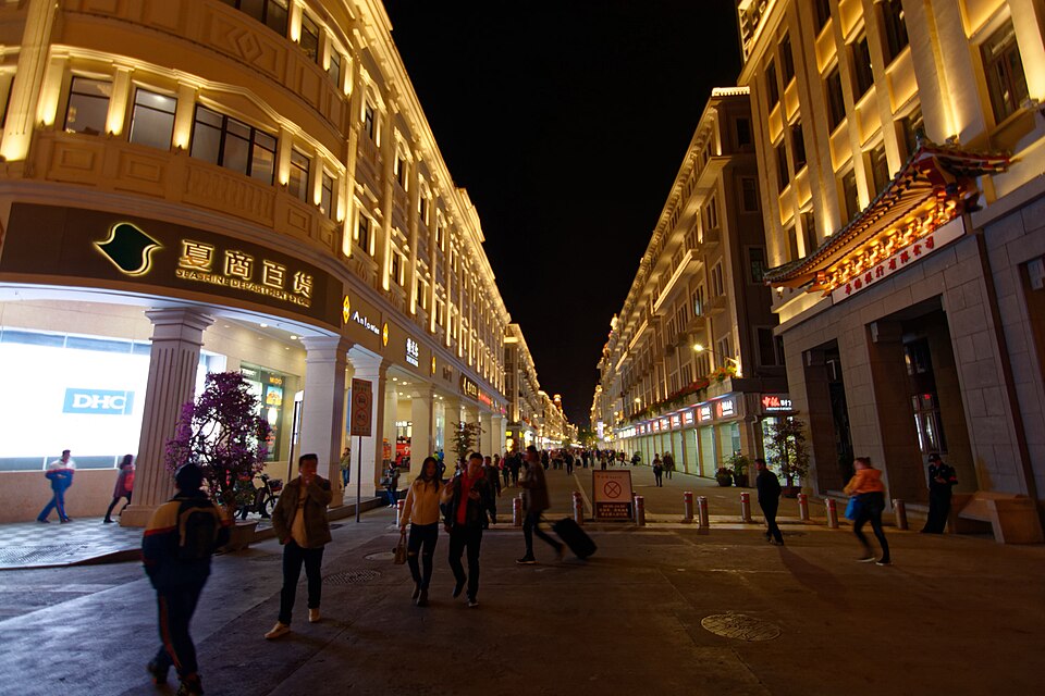 Lit arcade houses lining Zhongshan Road at night