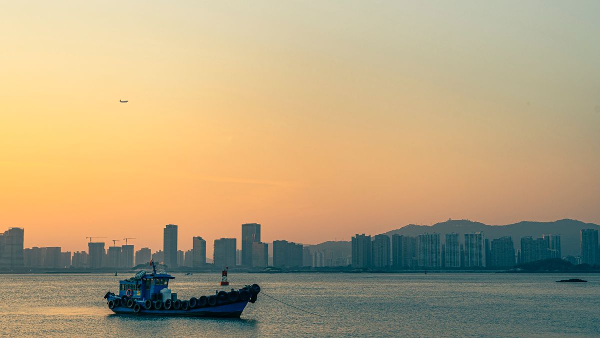 Xiamen skyline at sunset seen from the water