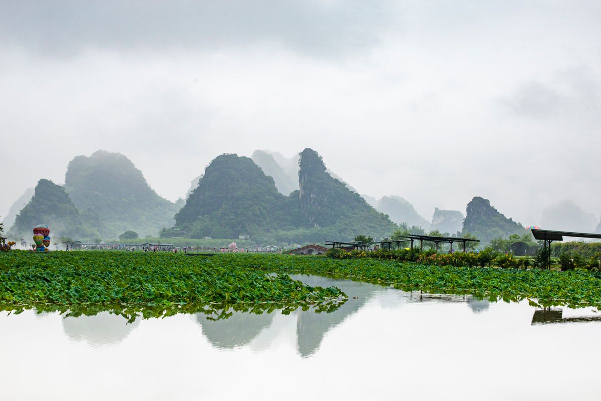 Aerial view of karst peaks, the river, and farmland around Yangshuo